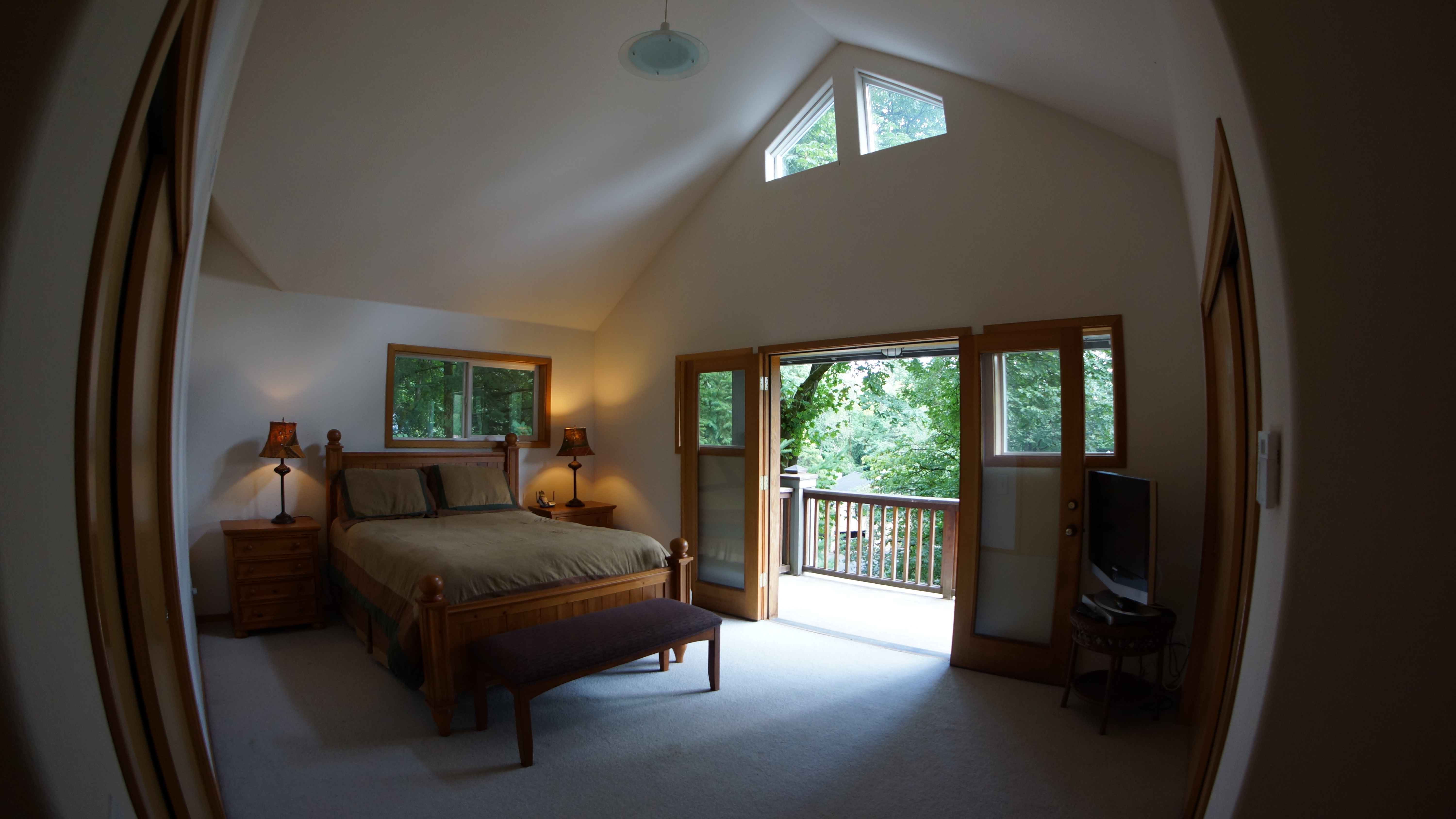 This bedroom has High Ceilings, many windows, and <BR>a Deck with Views.